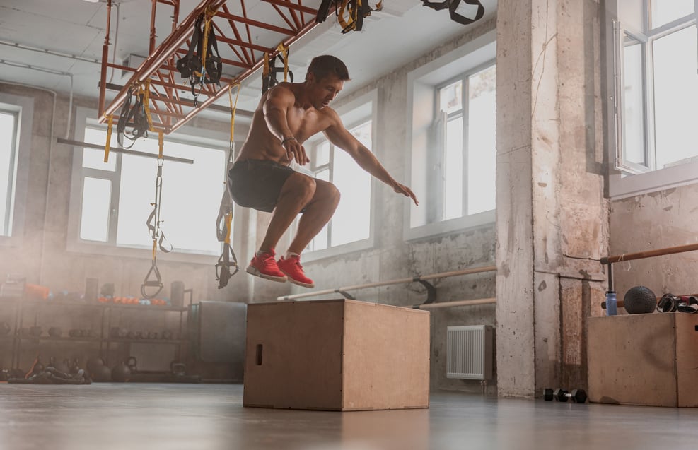 Sportive Man Performing Functional Training in Gym